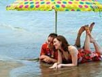 Couple sitting near the ocean