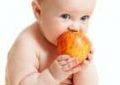 Baby eating an apple