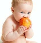 Baby eating an apple