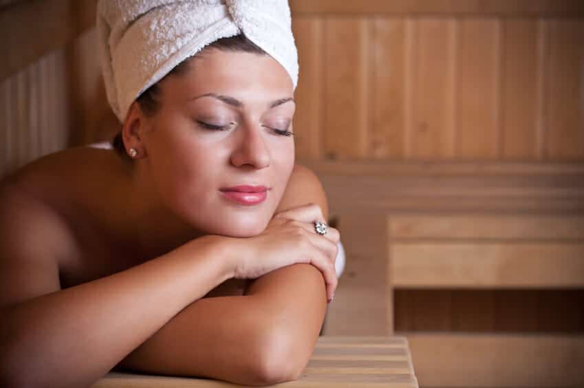 young woman relaxing in the sauna