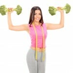 Woman holding broccoli