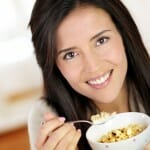 Woman eating cereal