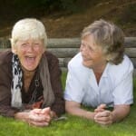 Two elderly ladies laughing