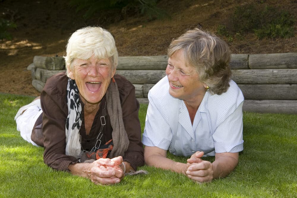Two elderly ladies laughing