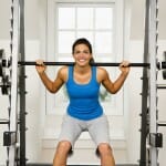 woman lifting weight in gym