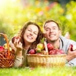 Couple enjoying eating apple