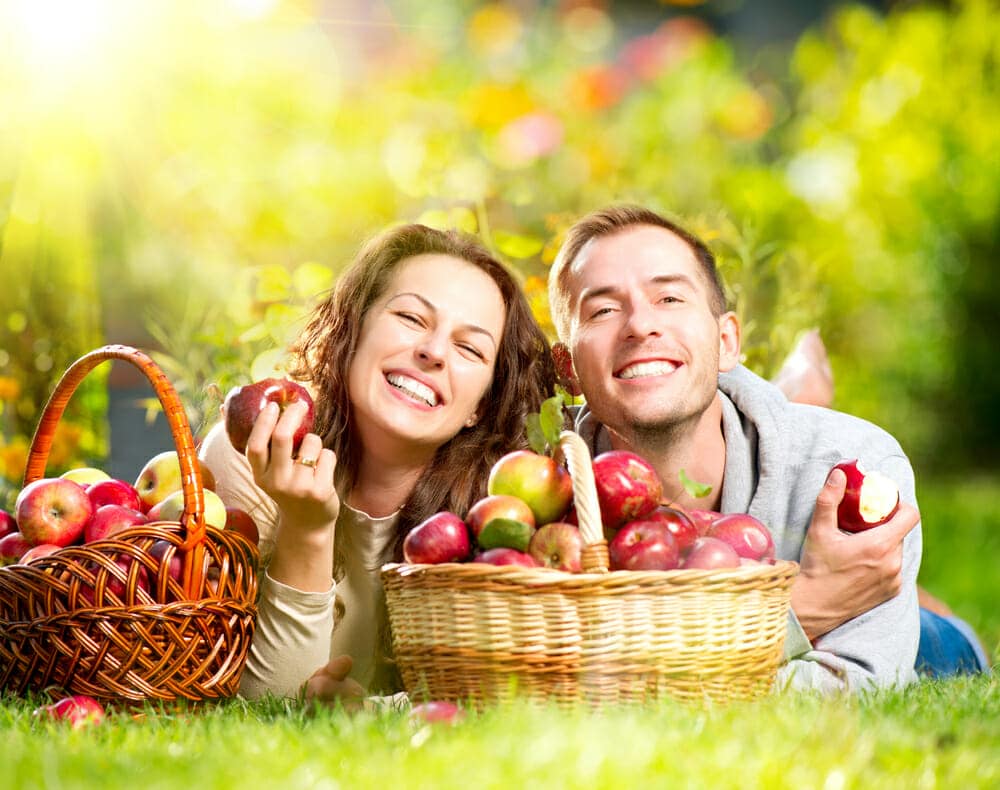 Couple enjoying eating apple