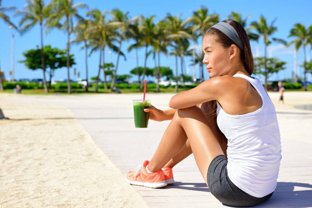 woman enjoying a Purium shake