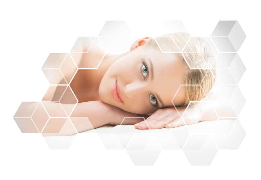 Beautiful and healthy blond woman getting massage treatment in beauty salon. Spa and healthcare concept.