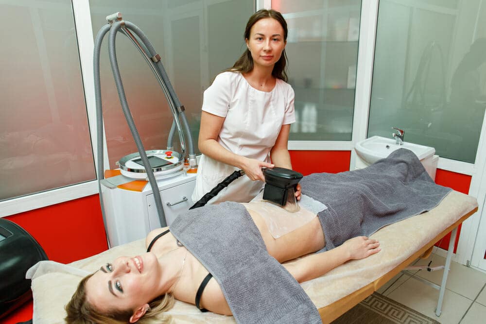 Cryolipolysis fat freezing treatment. Weight loss and slimming procedure in beauty salon