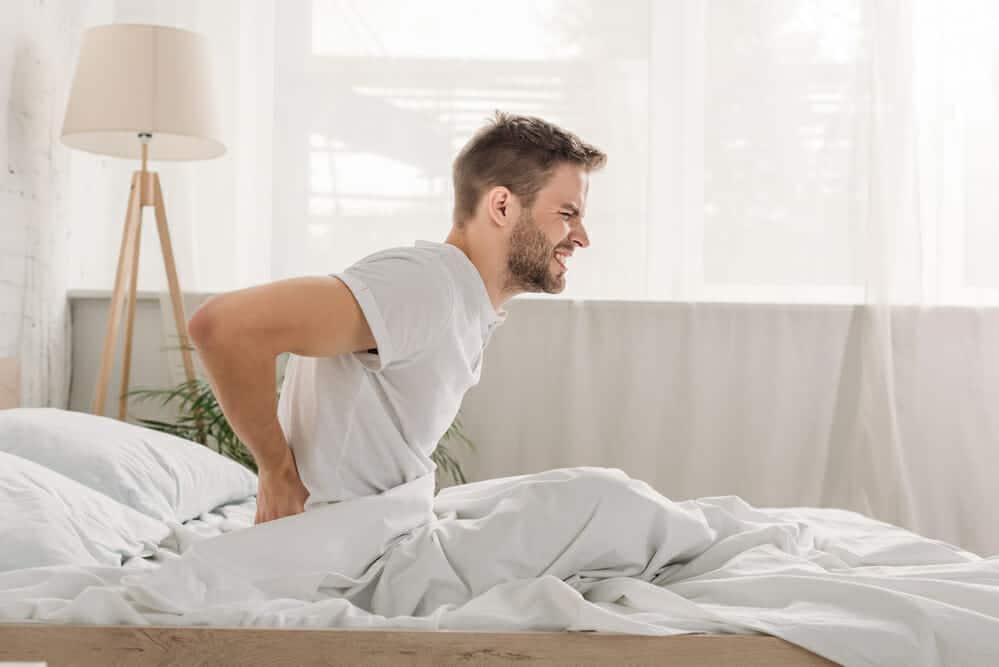 new firm mattress causing back pain